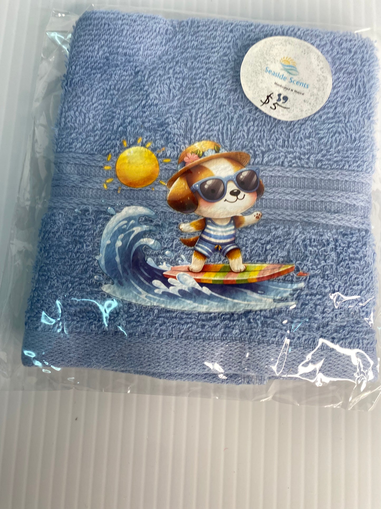Baby Face Washer- Surfing Dog with Sun on a Blue Washer