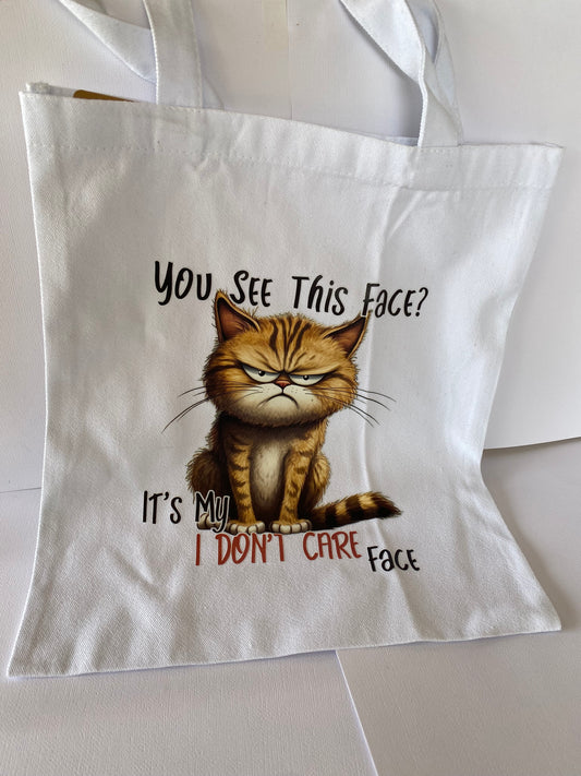 Cat on white tote bag