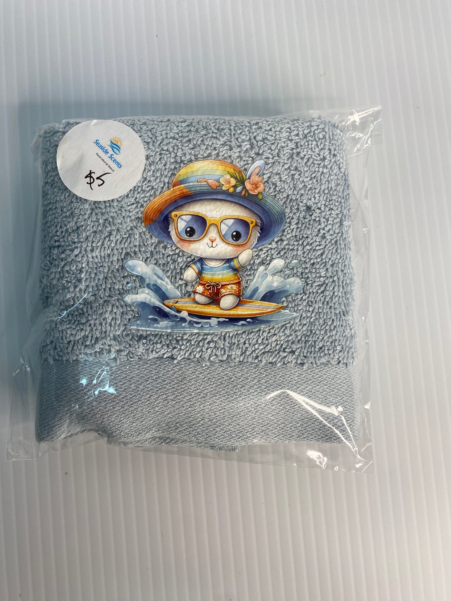 Baby Face Washer- Surfing Dog  on a Blue Washer