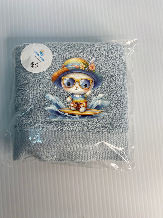 Baby Face Washer- Surfing Dog  on a Blue Washer