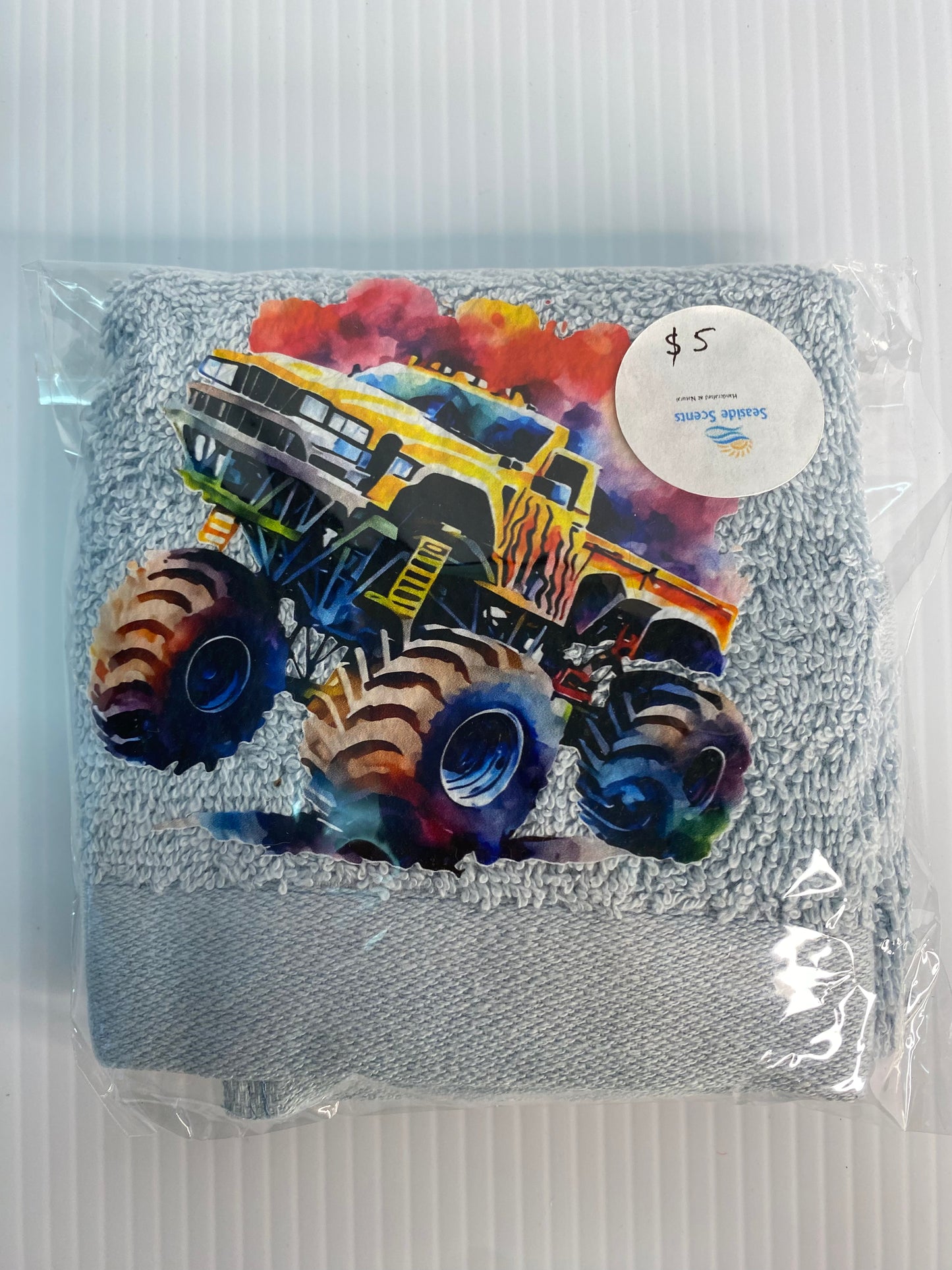 Baby Face Washer- Monster Truck  on a Blue Washer